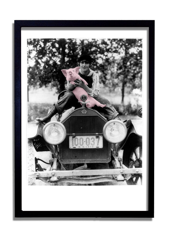 Holding the pig (on car)